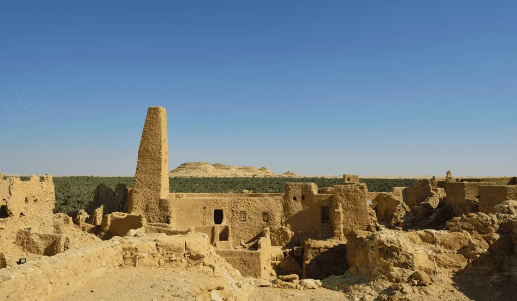 Temple of the Oracle of Amun A serene view of a clear blue sky above the Temple of the Oracle of Amun, showcasing a peaceful atmosphere.